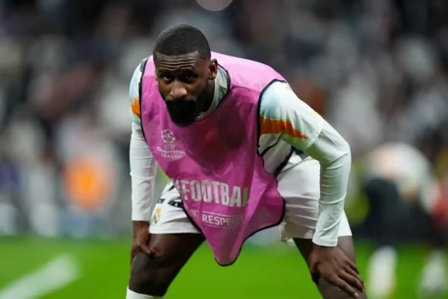 MADRID, SPAIN - APRIL 16: Antonio Ruediger of Real Madrid looks on as he warms up prior to the UEFA Champions League 2024/25 Quarter Final Second Leg match between Real Madrid C.F. and Arsenal FC at Estadio Santiago Bernabeu on April 16, 2025 in Madrid, Spain. (Photo by Angel Martinez/Getty Images).