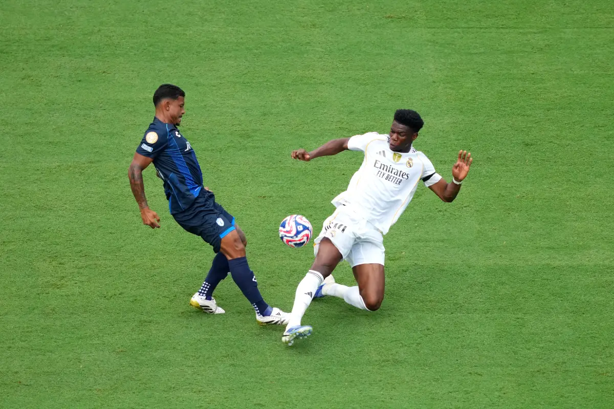 CHARLOTTE, NORTH CAROLINA - JUNE 22: Aurelien Tchouameni #14 of Real Madrid C.F. battles for possession with John Kennedy #10 of CF Pachuca during the FIFA Club World Cup 2025 group H match between Real Madrid CF and CF Pachuca at Bank of America Stadium on June 22, 2025 in Charlotte, North Carolina. (Photo by Michael Owens/Getty Images)