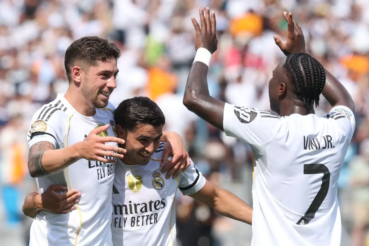 CHARLOTTE, NORTH CAROLINA - JUNE 22: Federico Valverde #8 of Real Madrid C. F. celebrates scoring his team's third goal with Brahim Diaz #21 and Vinicius Junior #7 of Real Madrid C. F. during the FIFA Club World Cup 2025 group H match between Real Madrid CF and CF Pachuca at Bank of America Stadium on June 22, 2025 in Charlotte, North Carolina. (Photo by Richard Pelham/Getty Images).