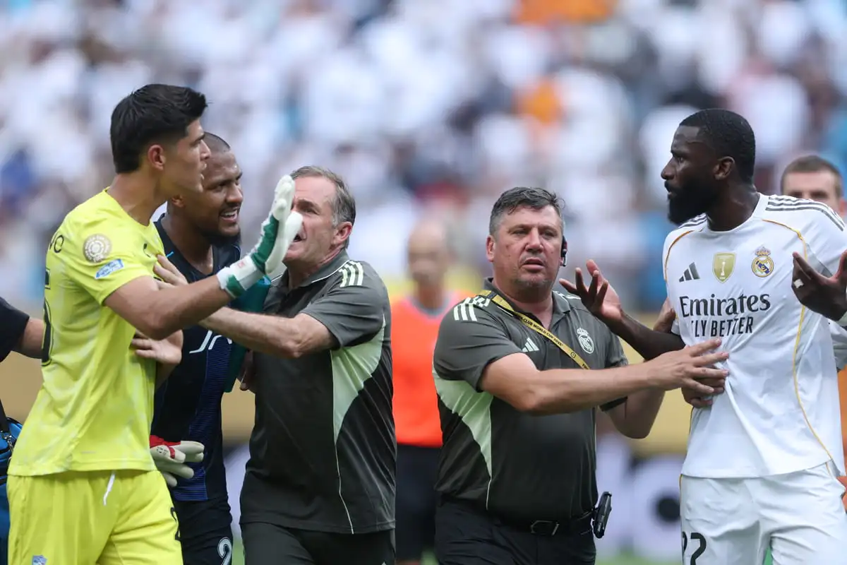 CHARLOTTE, NORTH CAROLINA - JUNE 22: Staff members separate Carlos Moreno #25 of CF Pachuca from Antonio Rudiger #22 of Real Madrid C. F. during an altercation in the FIFA Club World Cup 2025 group H match between Real Madrid CF and CF Pachuca at Bank of America Stadium on June 22, 2025 in Charlotte, North Carolina. (Photo by Richard Pelham/Getty Images)