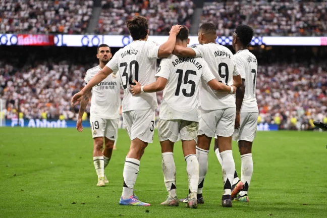 MADRID, SPAIN - MAY 24: Kylian Mbappe of Real Madrid celebrates scoring his team's opening goalbrates with teammates scoring Real's second goal during the LaLiga match between Real Madrid CF and Real Sociedad at Estadio Santiago Bernabeu on May 24, 2025 in Madrid,