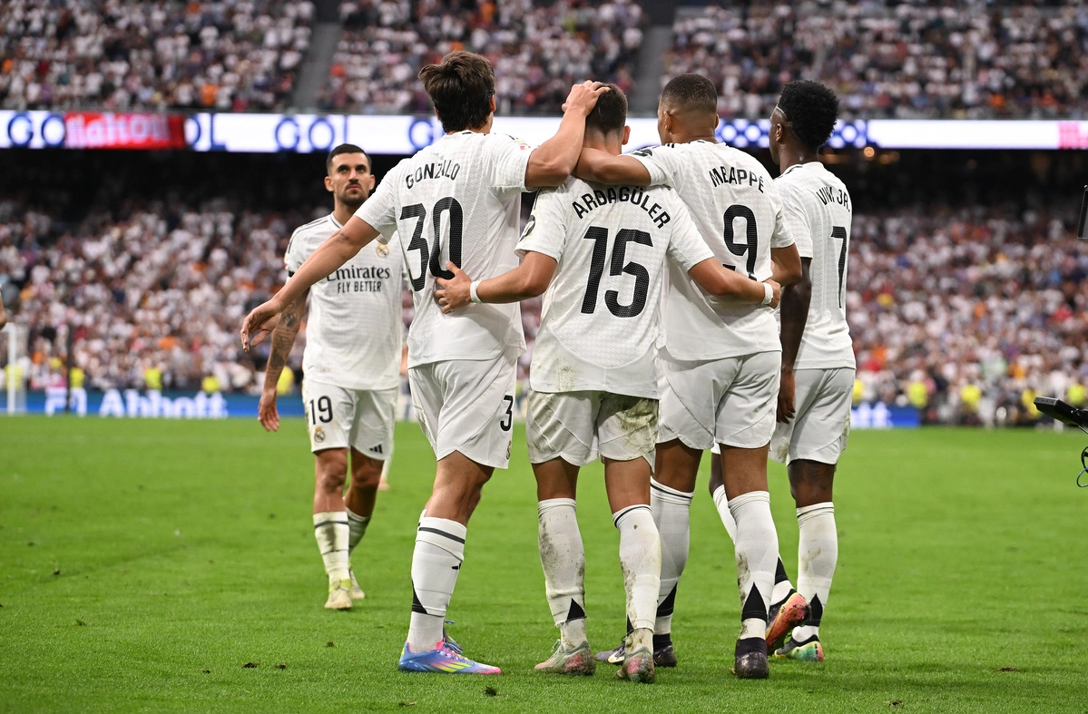 MADRID, SPAIN - MAY 24: Kylian Mbappe of Real Madrid celebrates scoring his team's opening goalbrates with teammates scoring Real's second goal during the LaLiga match between Real Madrid CF and Real Sociedad at Estadio Santiago Bernabeu on May 24, 2025 in Madrid,