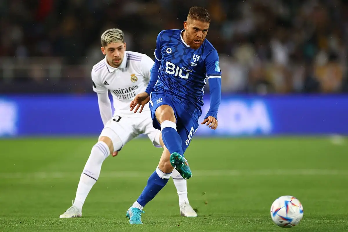 RABAT, MOROCCO - FEBRUARY 11: Gustavo Cuellar of Al Hilal tracked by Federico Valverde of Real Madrid during the FIFA Club World Cup Morocco 2022 Final match between Real Madrid and Al Hilal at Prince Moulay Abdellah on February 11, 2023 in Rabat, Morocco. (Photo by Michael Steele/Getty Images).