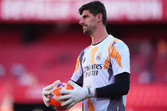 SEVILLE, SPAIN - MAY 18: Thibaut Courtois of Real Madrid looks on during the warm up prior to the LaLiga match between Sevilla FC and Real Madrid CF at Estadio Ramon Sanchez Pizjuan on May 18, 2025 in Seville, Spain. (Photo by Angel Martinez/Getty Images).