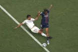 EAST RUTHERFORD, NEW JERSEY - JULY 09: Raul Asencio #35 of Real Madrid C.F. battles for possession with Bradley Barcola #29 of Paris Saint-Germain during the FIFA Club World Cup 2025 semi-final match between Paris Saint-Germain and Real Madrid CF at MetLife Stadium on July 09, 2025 in East Rutherford, New Jersey. (Photo by Al Bello/Getty Images)