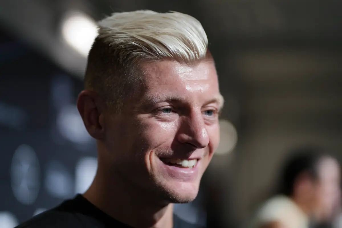COLOGNE, GERMANY - SEPTEMBER 01: Toni Kroos, German former football player, smiles as he is interviewed prior to the first matchday of the Icon League at Lanxess Arena on September 01, 2024 in Cologne, Germany. The Icon League, was founded in November last year. The aim of the small-sided indoor soccer league is to maximise the highlights of the game and create an innovative football spectacle. (Photo by Pau Barrena/Getty Images)