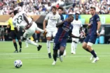 EAST RUTHERFORD, NEW JERSEY - JULY 09: Antonio Ruediger #22 of Real Madrid C.F. battles for possession with Nuno Mendes #25 of Paris Saint-Germain during the FIFA Club World Cup 2025 semi-final match between Paris Saint-Germain and Real Madrid CF at MetLife Stadium on July 09, 2025 in East Rutherford, New Jersey. (Photo by Alex Grimm/Getty Images)