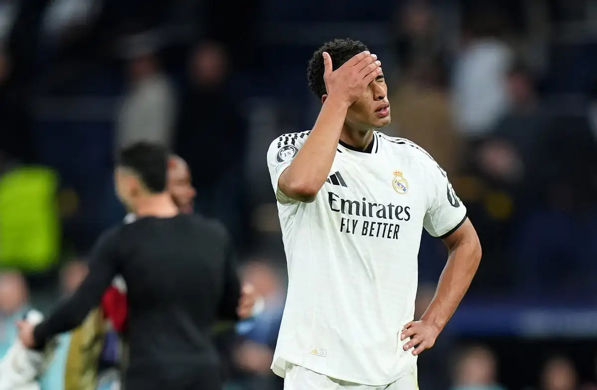 MADRID, SPAIN - APRIL 16: Jude Bellingham of Real Madrid looks dejected after the team's defeat in the UEFA Champions League 2024/25 Quarter Final Second Leg match between Real Madrid C.F. and Arsenal FC at Estadio Santiago Bernabeu on April 16, 2025 in Madrid, Spain. (Photo by Angel Martinez/Getty Images).
