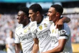 EAST RUTHERFORD, NEW JERSEY - JULY 05: Vinicius Junior #7, Jude Bellingham #5, and Trent Alexander-Arnold #12 of Real Madrid C.F. celebrate after Fran Garcia #20 (not pictured) scores his team's second goal during the FIFA Club World Cup 2025 quarter-final match between Real Madrid CF and Borussia Dortmund at MetLife Stadium on July 05, 2025 in East Rutherford, New Jersey. (Photo by Francois Nel/Getty Images)