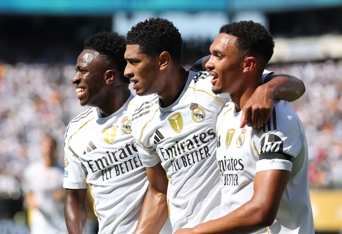EAST RUTHERFORD, NEW JERSEY - JULY 05: Vinicius Junior #7, Jude Bellingham #5, and Trent Alexander-Arnold #12 of Real Madrid C.F. celebrate after Fran Garcia #20 (not pictured) scores his team's second goal during the FIFA Club World Cup 2025 quarter-final match between Real Madrid CF and Borussia Dortmund at MetLife Stadium on July 05, 2025 in East Rutherford, New Jersey. (Photo by Francois Nel/Getty Images)