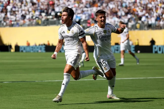 EAST RUTHERFORD, NEW JERSEY - JULY 05: Fran Garcia #20 of Real Madrid C.F. celebrates scoring his team's second goal with teammate Arda Gueler #15 during the FIFA Club World Cup 2025 quarter-final match between Real Madrid CF and Borussia Dortmund at MetLife Stadium on July 05, 2025 in East Rutherford, New Jersey. (Photo by Francois Nel/Getty Images)