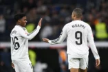 MADRID, SPAIN - FEBRUARY 23: Endrick of Real Madrid reacts with teammate Kylian Mbappe on the final whistle during the LaLiga match between Real Madrid CF and Girona FC at Estadio Santiago Bernabeu on February 23, 2025 in Madrid, Spain. (Photo by Denis Doyle/Getty Images)