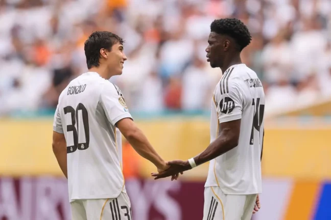 MIAMI GARDENS, FLORIDA - JULY 01: Gonzalo Garcia #30 and Aurelien Tchouameni #14 of Real Madrid C.F. react following the FIFA Club World Cup 2025 round of 16 match between Real Madrid CF and Juventus FC at Hard Rock Stadium on July 01, 2025 in Miami Gardens, Florida. (Photo by Michael Reaves/Getty Images).