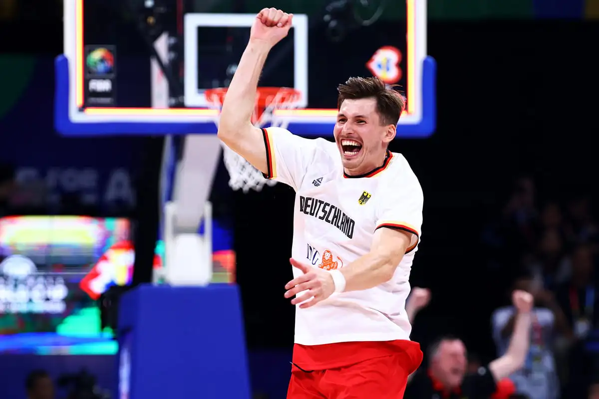 MANILA, PHILIPPINES - SEPTEMBER 08: David Kramer #44 of Germany celebrates after the FIBA Basketball World Cup semifinal game victory over the United States at Mall of Asia Arena on September 08, 2023 in Manila, Philippines. Germany won 113-111. (Photo by Yong Teck Lim/Getty Images)