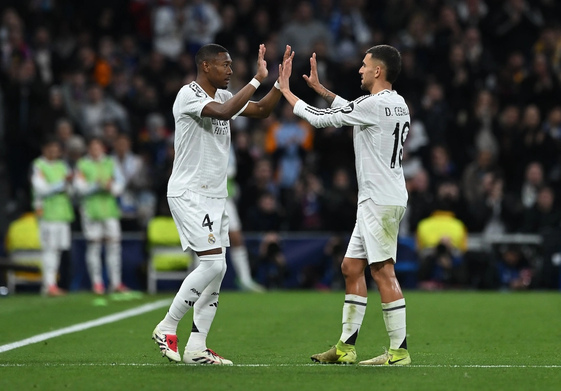 MADRID, SPAIN - JANUARY 22: David Alaba of Real Madrid interacts with Dani Ceballos as he leaves the field whilst being substituted during the UEFA Champions League 2024/25 League Phase MD7 match between Real Madrid C.F. and FC Salzburg at Estadio Santiago Bernabeu on January 22, 2025 in Madrid, Spain. (Photo by Denis Doyle/Getty Images)