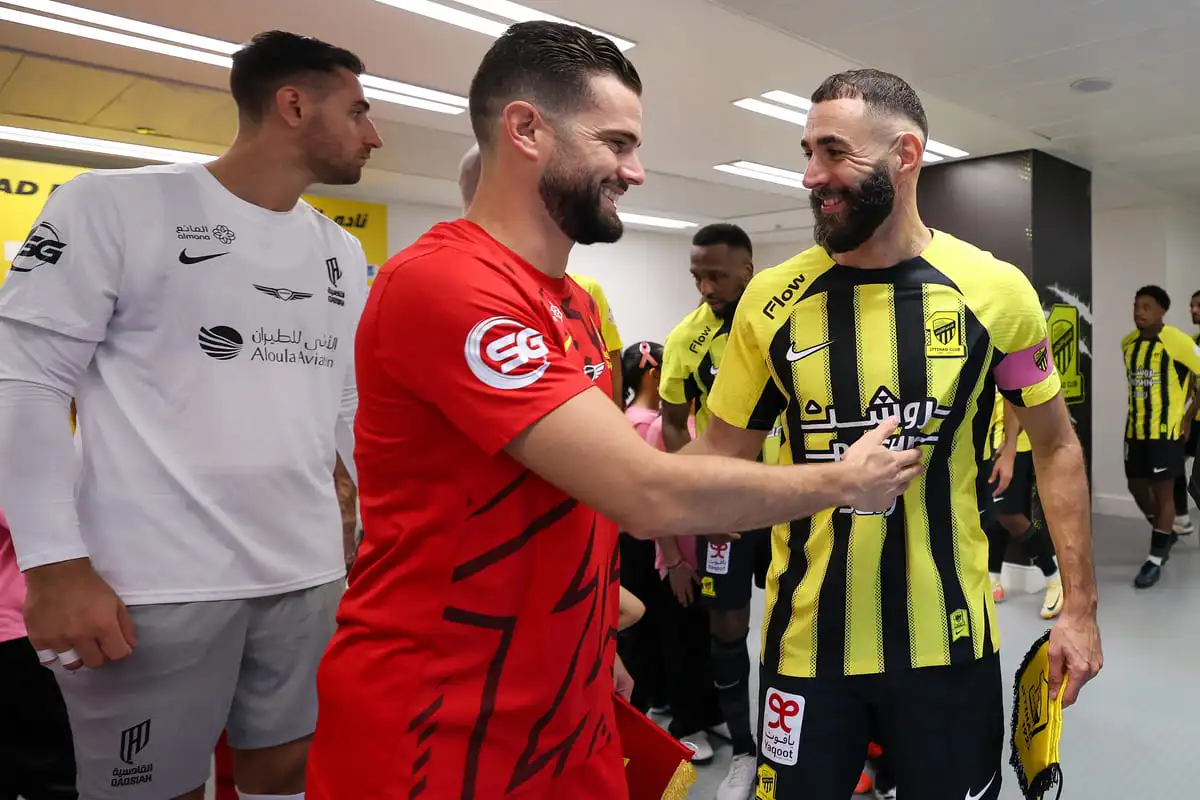 JEDDAH, SAUDI ARABIA - OCTOBER 19: Karim Benzema of Al Ittihad and Nacho Fernandez of Al Qadsiah greet before the Saudi Pro League match between Al Ittihad v Al Qadsiah FC at King Abdullah Sports City on October 19, 2024 in Jeddah, Saudi Arabia. (Photo by Yasser Bakhsh/Getty Images)