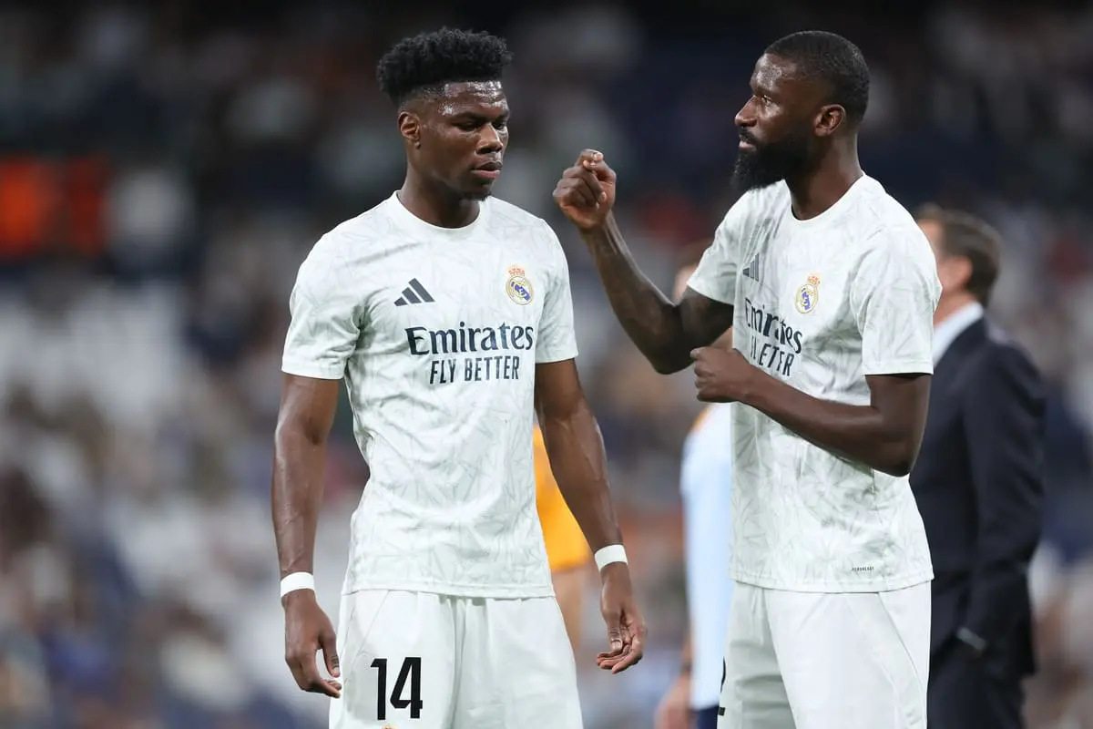 MADRID, SPAIN - OCTOBER 05: Antonio Rudiger (R) of Real Madrid CF speaks with his teammate Aurelien Tchouameni (L) during their warm up before the LaLiga match between Real Madrid CF and Villarreal CF at Estadio Santiago Bernabeu on October 05, 2024 in Madrid, Spain. (Photo by Gonzalo Arroyo Moreno/Getty Images)