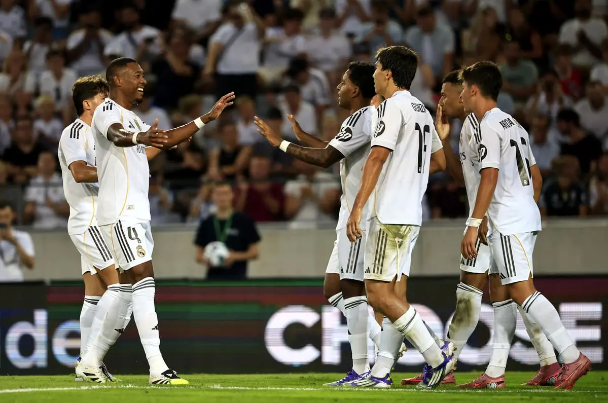 INNSBRUCK, AUSTRIA - AUGUST 12: Rodrygo of Real Madrid celebrates scoring his team's fourth goal with teammate David Alaba during the pre-season friendly match between WSG Tirol and Real Madrid CF at Tivoli Stadion Tirol on August 12, 2025 in Innsbruck, Austria. (Photo by Jan Hetfleisch/Getty Images)