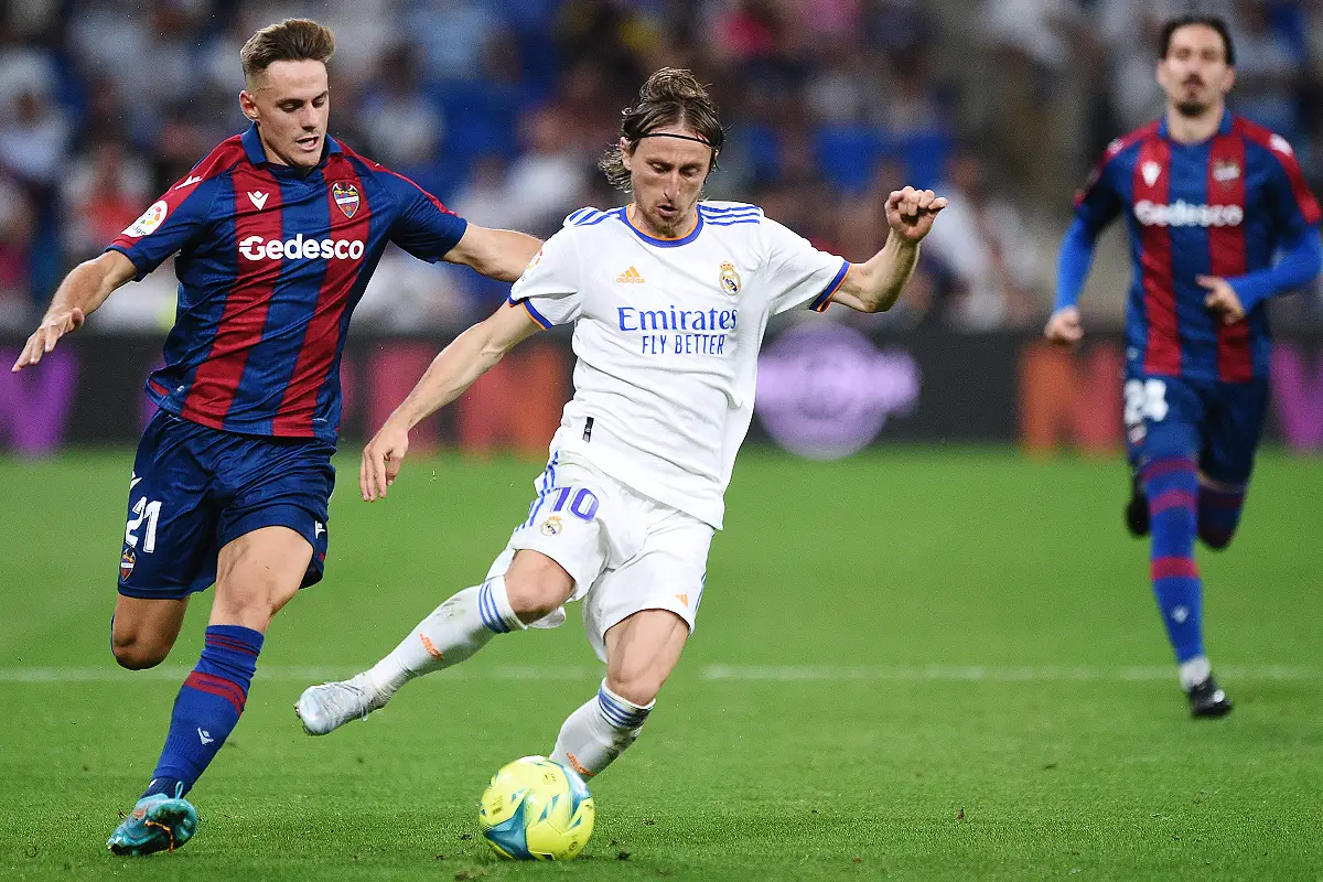 MADRID, SPAIN - MAY 12: Luka Modric of Real Madrid battles for possession with Dani Gomez of Levante during the La Liga Santander match between Real Madrid CF and Levante UD at Estadio Santiago Bernabeu on May 12, 2022 in Madrid, Spain. (Photo by Denis Doyle/Getty Images)