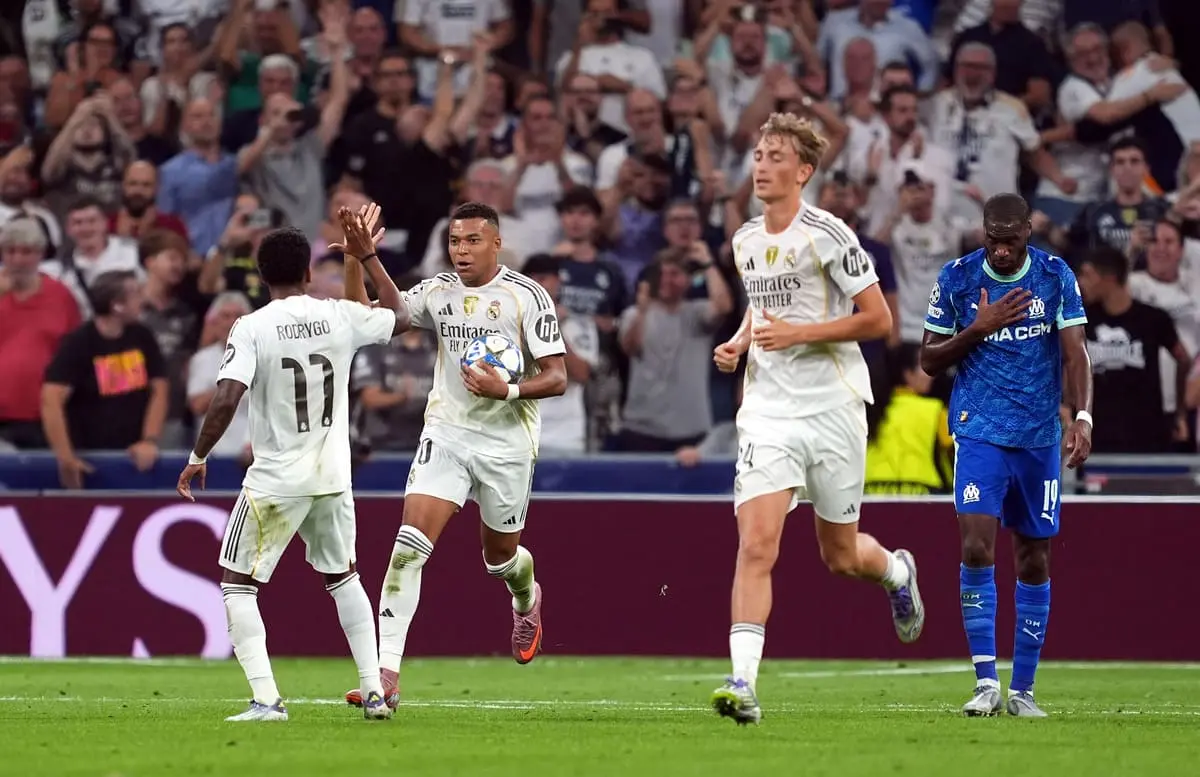 MADRID, SPAIN - SEPTEMBER 16: Kylian Mbappe of Real Madrid celebrates with Rodrygo after scoring his team's first goal from the penalty spot during the UEFA Champions League 2025/26 League Phase MD1 match between Real Madrid C.F. and Olympique de Marseille at Estadio Santiago Bernabeu on September 16, 2025 in Madrid, Spain. (Photo by Mateo Villalba Sanchez/Getty Images).