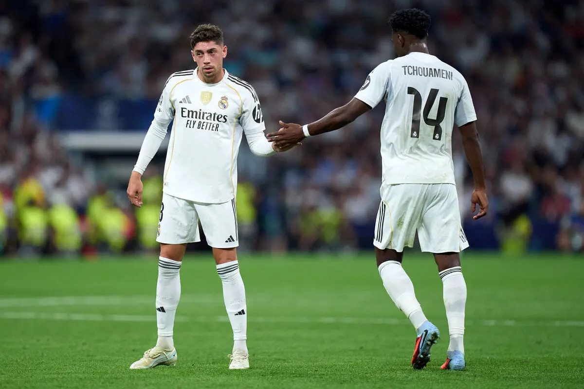 MADRID, SPAIN - SEPTEMBER 16: Federico Valverde and Aurelien Tchouameni of Real Madrid shake hands during the UEFA Champions League 2025/26 League Phase MD1 match between Real Madrid C.F. and Olympique de Marseille at Estadio Santiago Bernabeu on September 16, 2025 in Madrid, Spain. (Photo by Angel Martinez/Getty Images).
