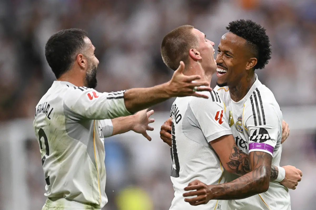 MADRID, SPAIN - SEPTEMBER 20: Eder Militao (R) of Real Madrid celebrates with teammates Daniel Carvajal and Franco Mastantuono after Militao scoring his team's opening goal during the LaLiga EA Sports match between Real Madrid CF and RCD Espanyol de Barcelona at Estadio Santiago Bernabeu on September 20, 2025 in Madrid, Spain. (Photo by Denis Doyle/Getty Images)