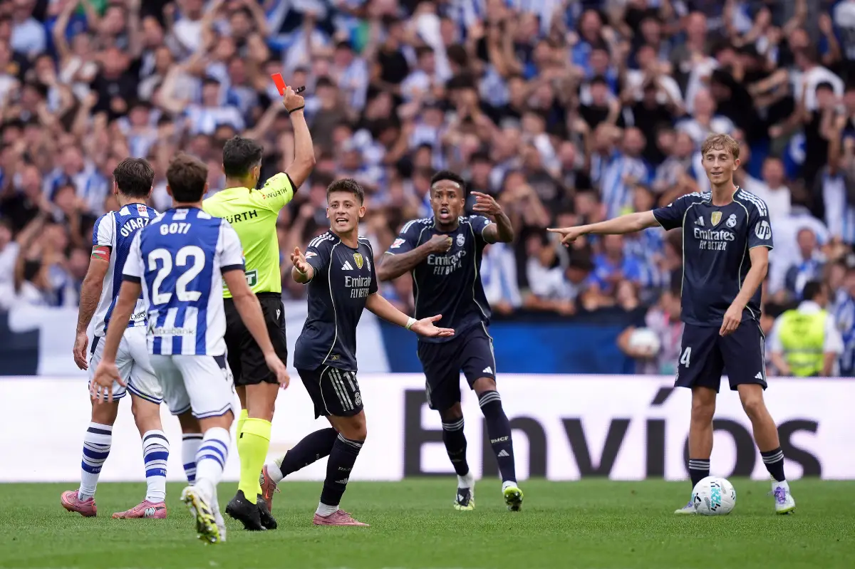 SAN SEBASTIAN, SPAIN - SEPTEMBER 13: Dean Huijsen of Real Madrid is shown a red card by referee during the LaLiga EA Sports match between Real Sociedad and Real Madrid CF at Reale Arena on September 13, 2025 in San Sebastian, Spain. (Photo by Juan Manuel Serrano Arce/Getty Images)