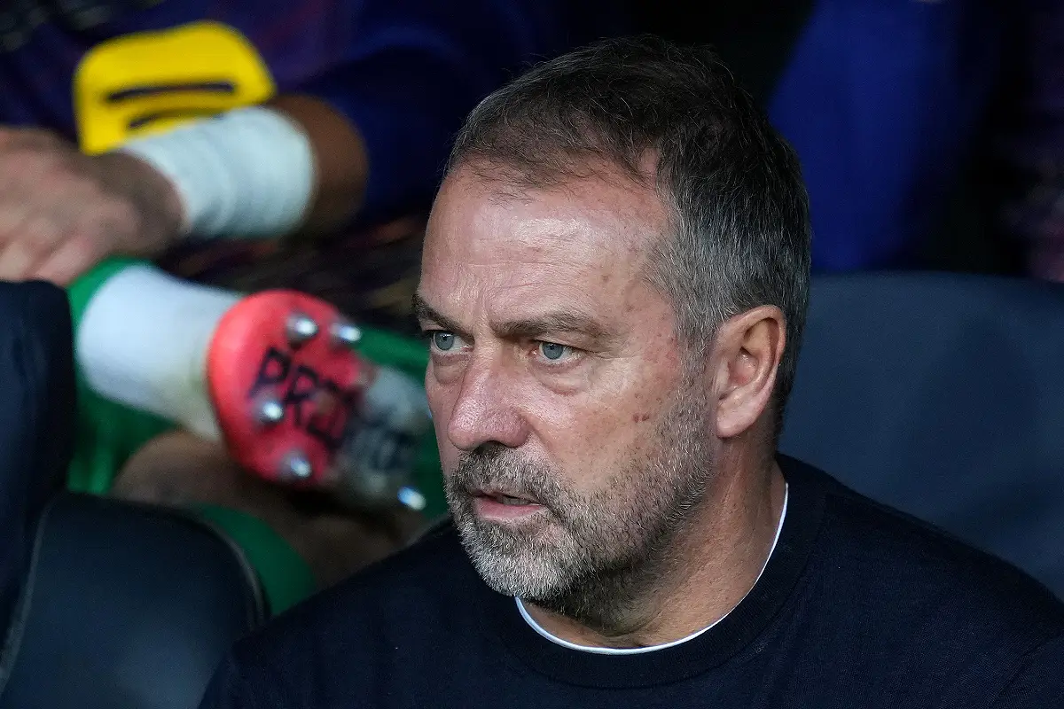 BARCELONA, SPAIN - OCTOBER 21: Hansi Flick, Head Coach of FC Barcelona, looks on from the bench prior to the UEFA Champions League 2025/26 League Phase MD3 match between FC Barcelona and Olympiacos FC at Estadi Olimpic Lluis Companys on October 21, 2025 in Barcelona, Spain. (Photo by Alex Caparros/Getty Images)