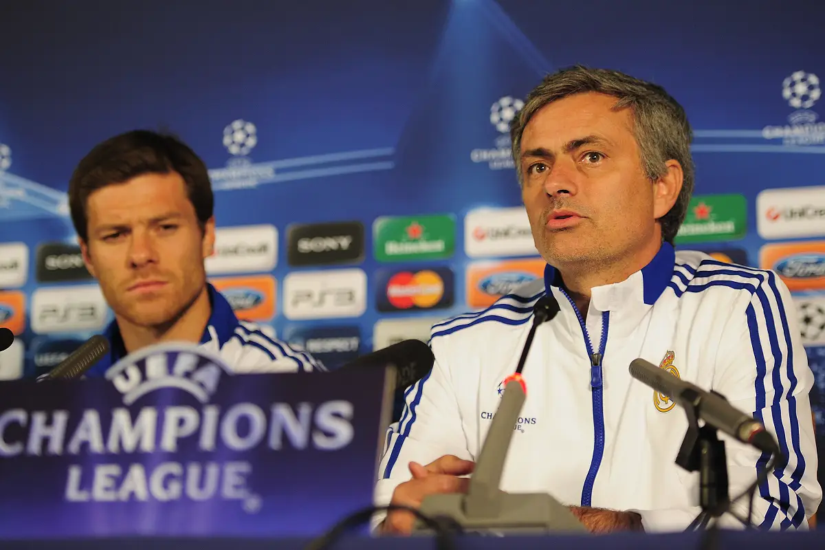LONDON, ENGLAND - APRIL 12: Jose Mourinho the Real Madrid manager and player Xabi Alonso talk to the media during a press conference on the eve of their UEFA Champions League quarter-final second leg match against Tottenham Hotspur at White Hart Lane on April 12, 2011 in London, England. (Photo by Shaun Botterill/Getty Images)
