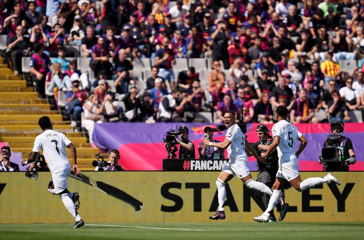 BARCELONA, SPAIN - MAY 11: Kylian Mbappe of Real Madrid celebrates scoring his team's first goal from the penalty spot during the LaLiga match between FC Barcelona and Real Madrid CF at Estadi Olimpic Lluis Companys on May 11, 2025 in Barcelona, Spain. (Photo by Alex Caparros/Getty Images)