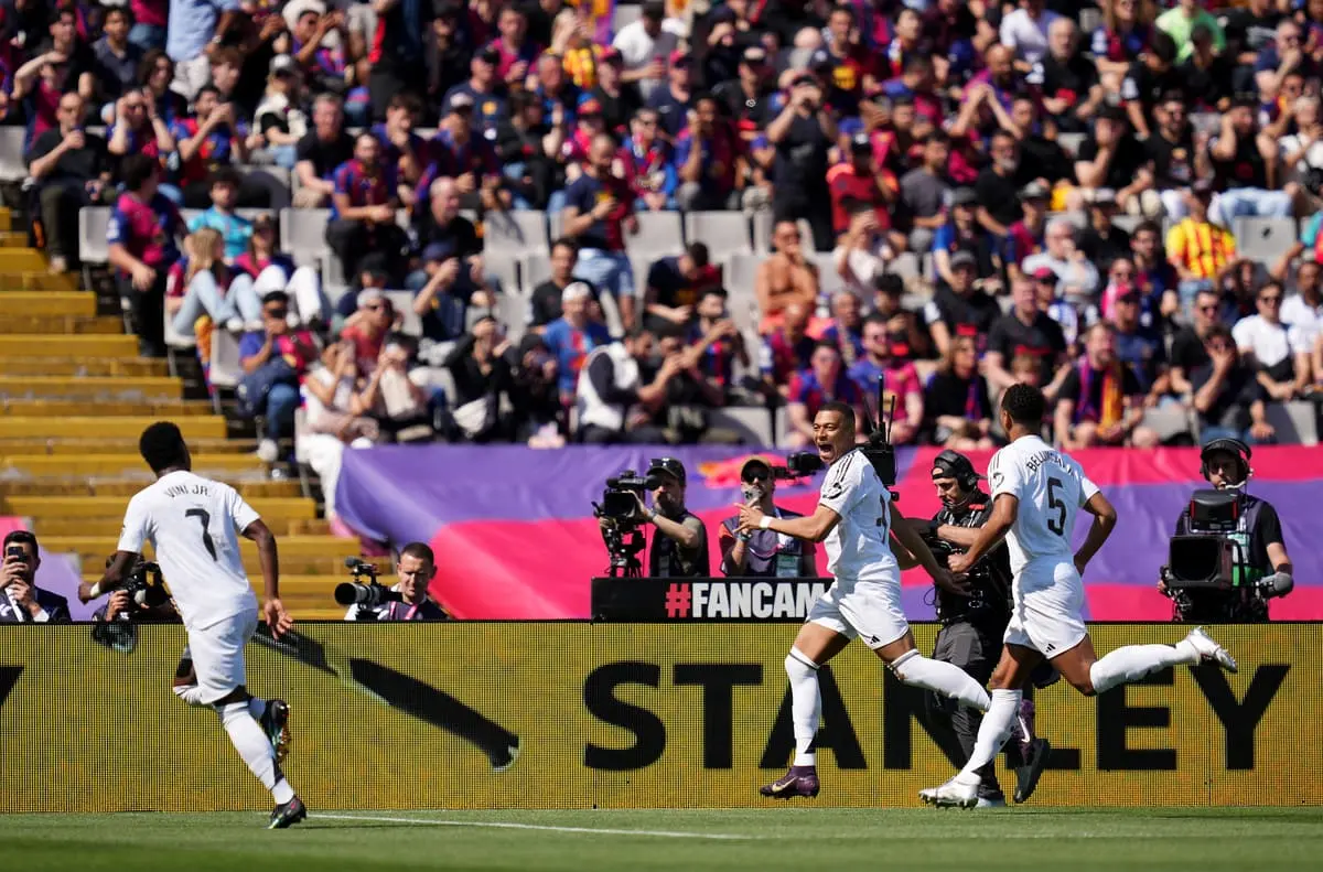 BARCELONA, SPAIN - MAY 11: Kylian Mbappe of Real Madrid celebrates scoring his team's first goal from the penalty spot during the LaLiga match between FC Barcelona and Real Madrid CF at Estadi Olimpic Lluis Companys on May 11, 2025 in Barcelona, Spain. (Photo by Alex Caparros/Getty Images)