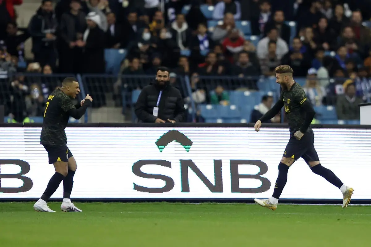 RIYADH, SAUDI ARABIA - JANUARY 19: Sergio Ramos of Paris Saint-Germain celebrates with teammate Kylian Mbappe after scoring the side's third goal during the Winter Tour 2023 friendly between Paris Saint-Germain and Riyadh XI at King Fahd International Stadium on January 19, 2023 in Riyadh, Saudi Arabia. (Photo by Yasser Bakhsh/Getty Images)