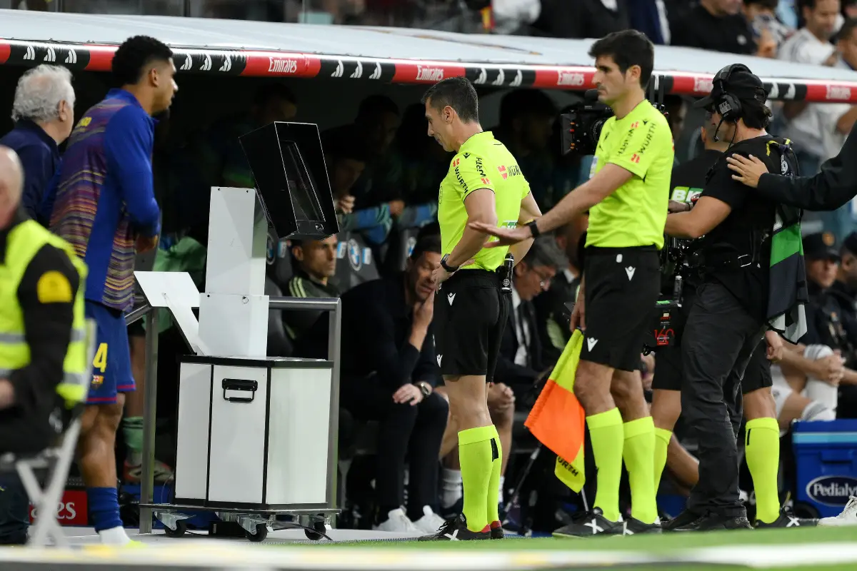 MADRID, SPAIN - OCTOBER 26: Referee Cesar Soto Grado watches a VAR Review following a potential penalty incident during the LaLiga EA Sports match between Real Madrid CF and FC Barcelona at Estadio Santiago Bernabeu on October 26, 2025 in Madrid, Spain. (Photo by David Ramos/Getty Images)