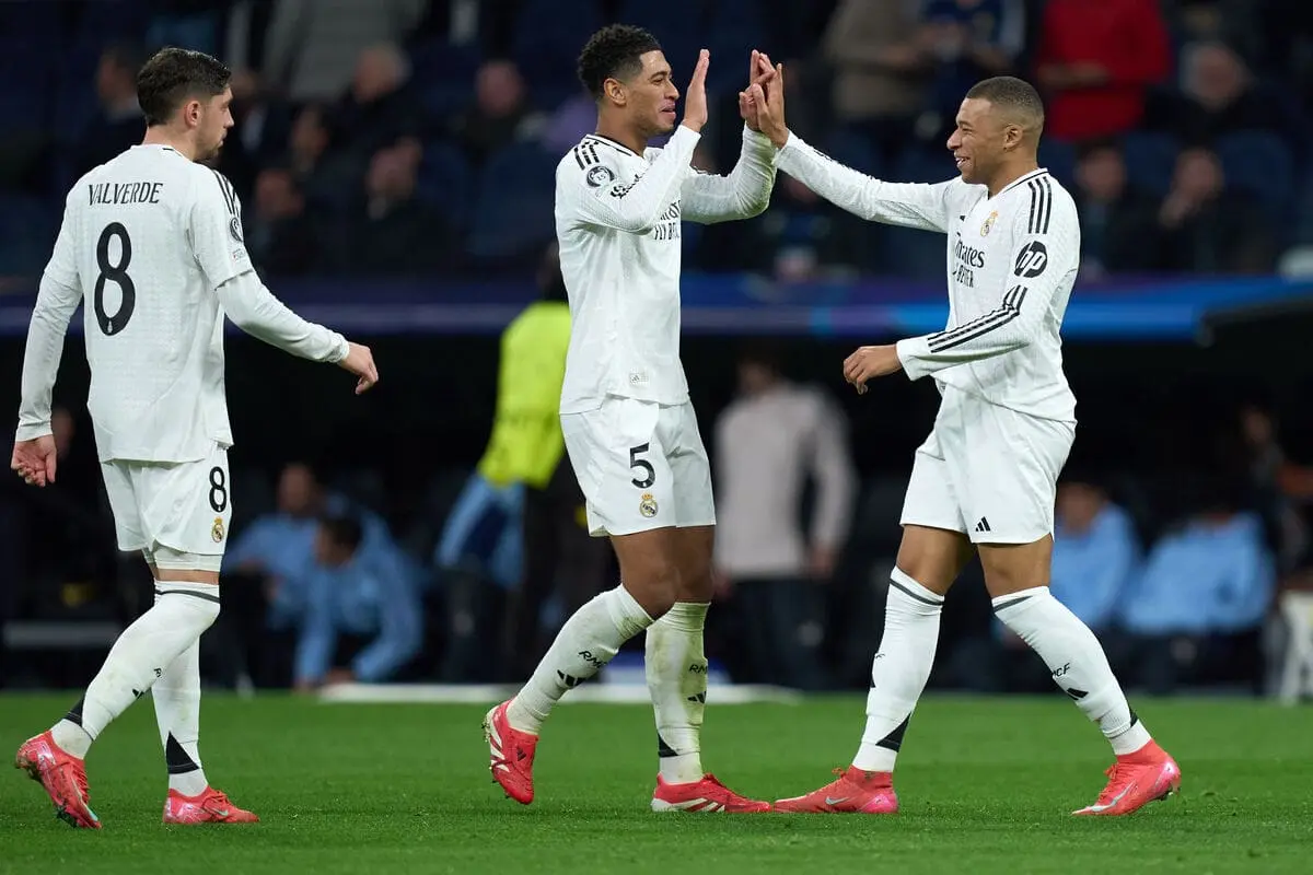 FIFPRO - MADRID, SPAIN - JANUARY 22: Kylian Mbappe of Real Madrid celebrates scoring his team's third goal with teammates Jude Bellingham and Federico Valverde during the UEFA Champions League 2024/25 League Phase MD7 match between Real Madrid C.F. and FC Salzburg at Estadio Santiago Bernabeu on January 22, 2025 in Madrid, Spain. (Photo by Angel Martinez/Getty Images).