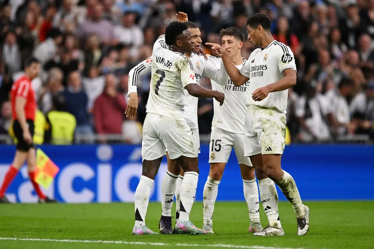MADRID, SPAIN - MAY 04: Kylian Mbappe of Real Madrid celebrates scoring his team's second goal with teammates Vinicius Junior, Arda Gueler and Jude Bellingham during the LaLiga match between Real Madrid CF and RC Celta de Vigo at Estadio Santiago Bernabeu on May 04, 2025 in Madrid, Spain. (Photo by Denis Doyle/Getty Images).