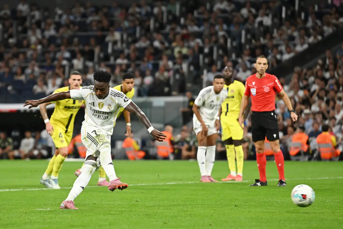 MADRID, SPAIN - OCTOBER 04: Vinicius Junior of Real Madrid scores his team's second goal from the penalty spot during the LaLiga EA Sports match between Real Madrid CF and Villarreal CF at Estadio Santiago Bernabeu on October 04, 2025 in Madrid, Spain. (Photo by Denis Doyle/Getty Images)