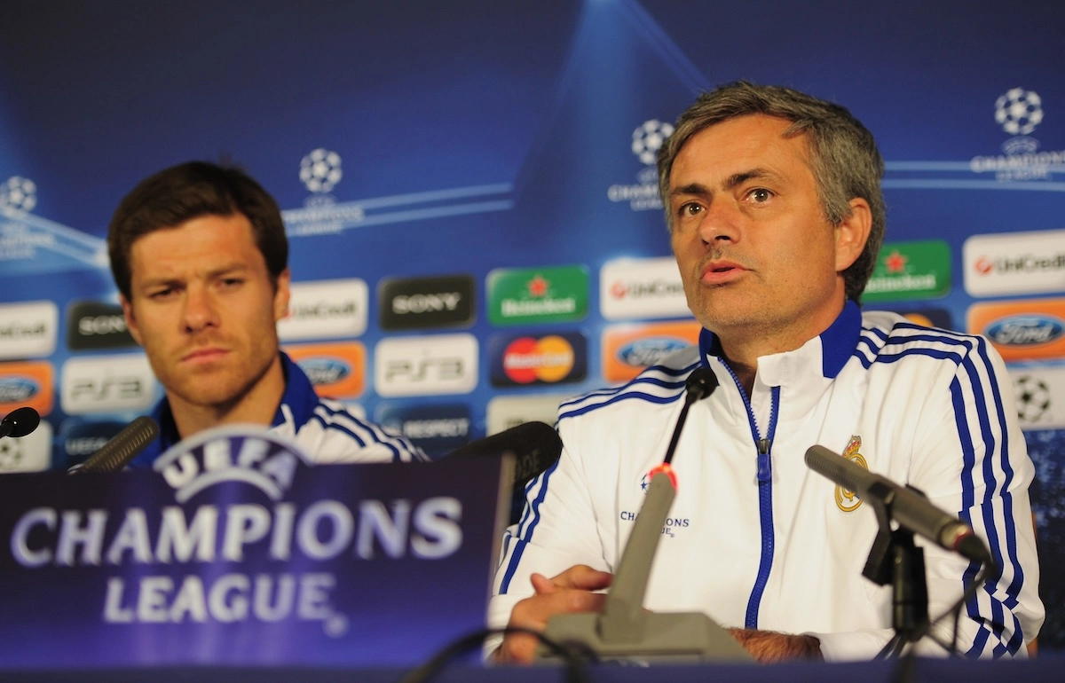 LONDON, ENGLAND - APRIL 12: Jose Mourinho the Real Madrid manager and player Xabi Alonso talk to the media during a press conference on the eve of their UEFA Champions League quarter-final second leg match against Tottenham Hotspur at White Hart Lane on April 12, 2011 in London, England. (Photo by Shaun Botterill/Getty Images)