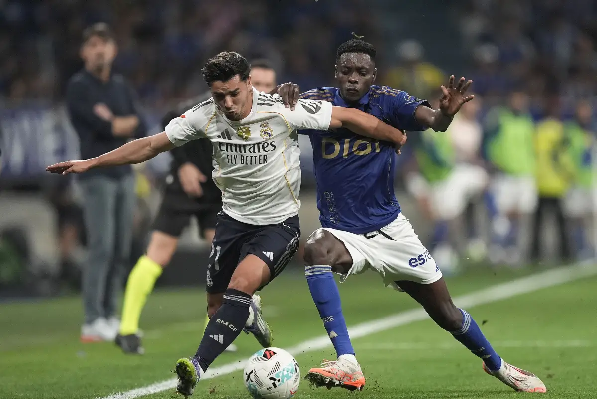 OVIEDO, SPAIN - AUGUST 24: Brahim Díaz of Real Madrid is challenged by Rahim Alhassane of Real Oviedo during the LaLiga EA Sports match between Real Oviedo and Real Madrid CF at Carlos Tartiere on August 24, 2025 in Oviedo, Spain. (Photo by Juan Manuel Serrano Arce/Getty Images)