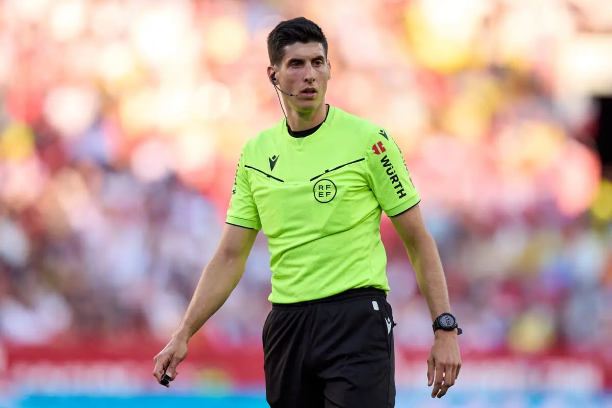 SEVILLE, SPAIN - MAY 18: Referee Mateo Busquets Ferrer looks on during the LaLiga match between Sevilla FC and Real Madrid CF at Estadio Ramon Sanchez Pizjuan on May 18, 2025 in Seville, Spain. (Photo by Angel Martinez/Getty Images)