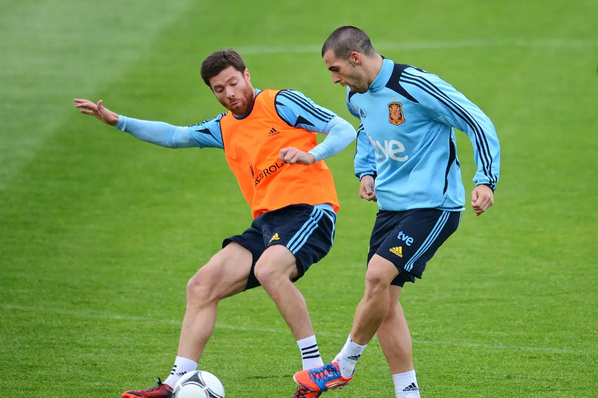 GNIEWINO, POLAND - JUNE 16: Alvaro Negredo (R) of Spain duels for the ball with Xabi Alonso during a UEFA EURO 2012 training session on June 16, 2012 in Gniewino, Poland. (Photo by Jasper Juinen/Getty Images)