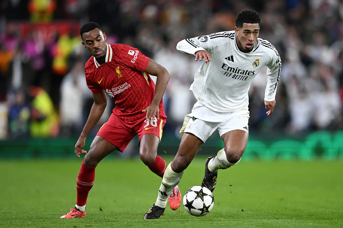 LIVERPOOL, ENGLAND - NOVEMBER 27: Jude Bellingham of Real Madrid takes Ryan Gravenberch of Liverpool during the UEFA Champions League 2024/25 League Phase MD5 match between Liverpool FC and Real Madrid C.F. at Anfield on November 27, 2024 in Liverpool, England. (Photo by Justin Setterfield/Getty Images)