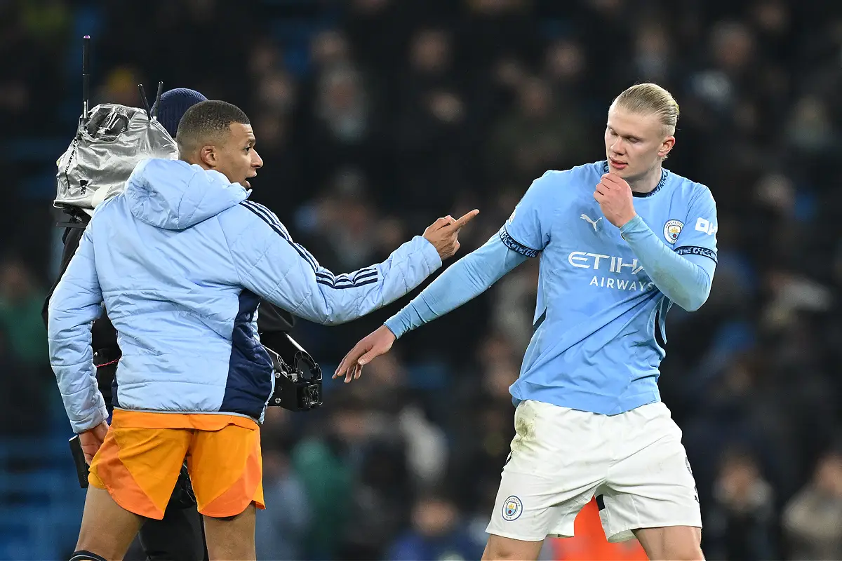 MANCHESTER, ENGLAND - FEBRUARY 11: Kylian Mbappe of Real Madrid speaks with Erling Haaland of Manchester City after the UEFA Champions League 2024/25 League Knockout Play-off first leg match between Manchester City and Real Madrid C.F. at Manchester City Stadium on February 11, 2025 in Manchester, England. (Photo by Michael Regan/Getty Images)