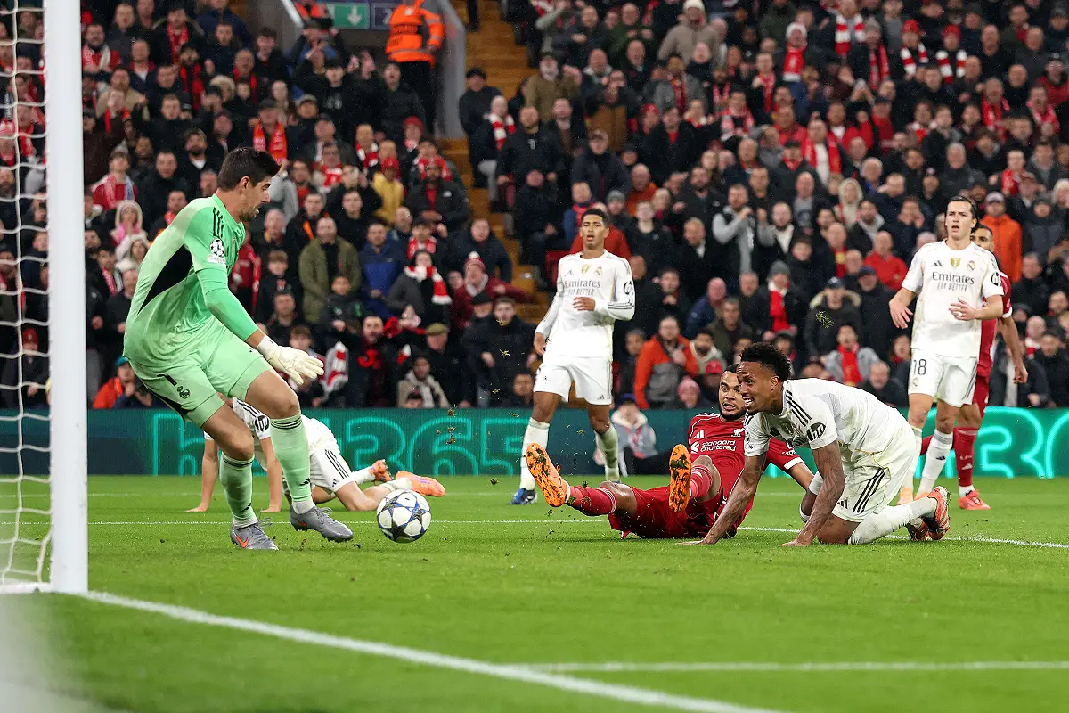 LIVERPOOL, ENGLAND - NOVEMBER 04: Cody Gakpo of Liverpool has a shot saved by Thibaut Courtois of Real Madrid during the UEFA Champions League 2025/26 League Phase MD4 match between Liverpool FC and Real Madrid C.F. at Anfield on November 04, 2025 in Liverpool, England. (Photo by Carl Recine/Getty Images)