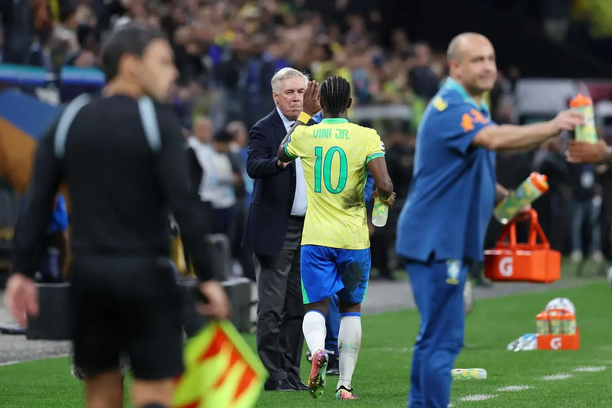 SAO PAULO, BRAZIL - JUNE 10: Vinicius Junior of Brazil celebrates with Carlo Ancelotti, Head Coach of Brazil, after scoring the team's first goal during the FIFA World Cup 2026 South American Qualifier between Brazil and Paraguay at Neo Quimica Arena on June 10, 2025 in Sao Paulo, Brazil. (Photo by Wagner Meier/Getty Images)