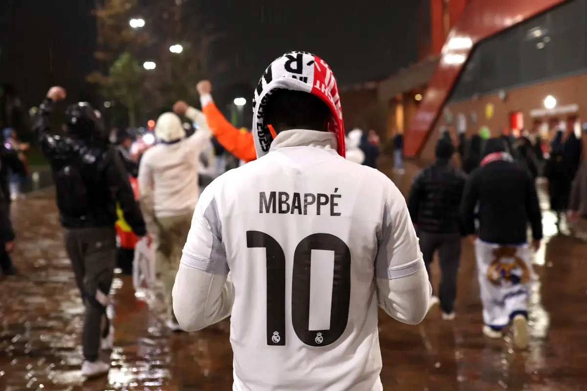LIVERPOOL, ENGLAND - NOVEMBER 04: A fan of Real Madrid wears a shirt dedicated to Kylian Mbappe outside the stadium prior to the UEFA Champions League 2025/26 League Phase MD4 match between Liverpool FC and Real Madrid C.F. at Anfield on November 04, 2025 in Liverpool, England. (Photo by Michael Regan/Getty Images)