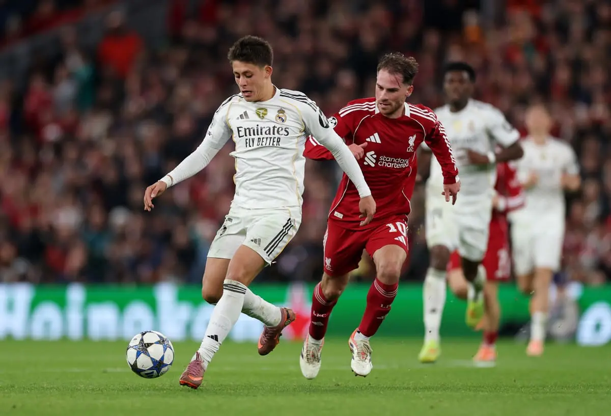 LIVERPOOL, ENGLAND - NOVEMBER 04: Arda Gueler of Real Madrid breaks away from Alexis Mac Allister of Liverpool during the UEFA Champions League 2025/26 League Phase MD4 match between Liverpool FC and Real Madrid C.F. at Anfield on November 04, 2025 in Liverpool, England. (Photo by Michael Regan/Getty Images)