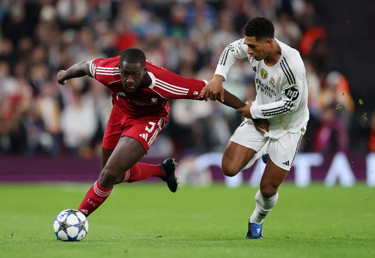 LIVERPOOL, ENGLAND - NOVEMBER 04: Ibrahima Konate of Liverpool is challenged by Jude Bellingham of Real Madrid during the UEFA Champions League 2025/26 League Phase MD4 match between Liverpool FC and Real Madrid C.F. at Anfield on November 04, 2025 in Liverpool, England. (Photo by Michael Regan/Getty Images).