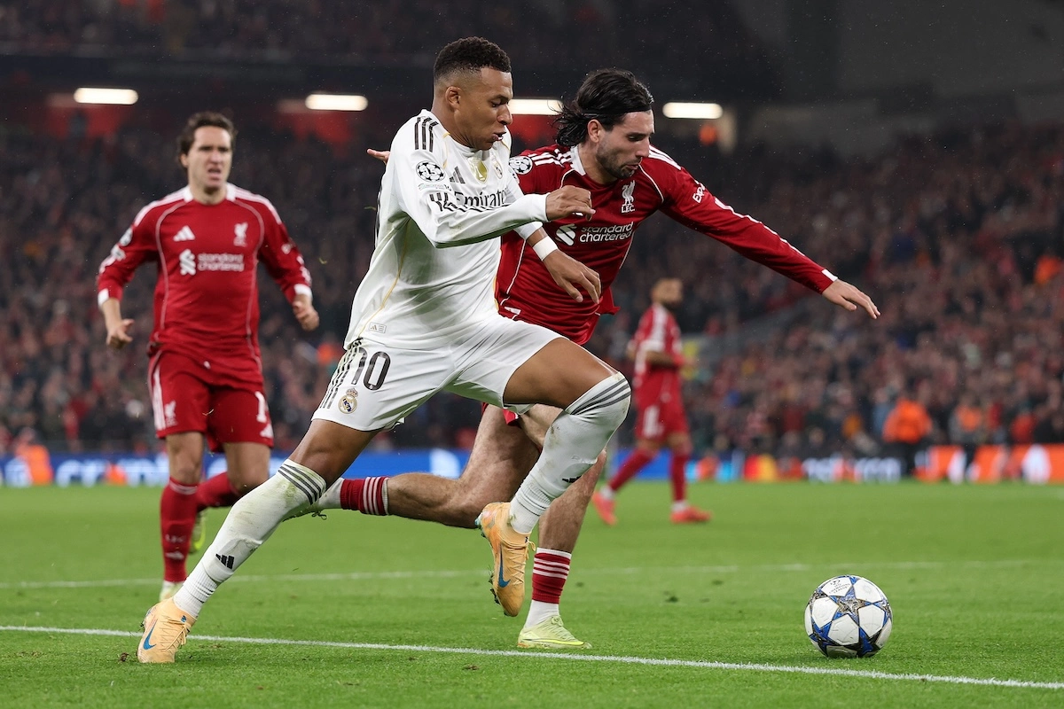 LIVERPOOL, ENGLAND - NOVEMBER 04: Kylian Mbappe of Real Madrid battles for possession with Dominik Szoboszlai of Liverpool during the UEFA Champions League 2025/26 League Phase MD4 match between Liverpool FC and Real Madrid C.F. at Anfield on November 04, 2025 in Liverpool, England. (Photo by Michael Regan/Getty Images)
