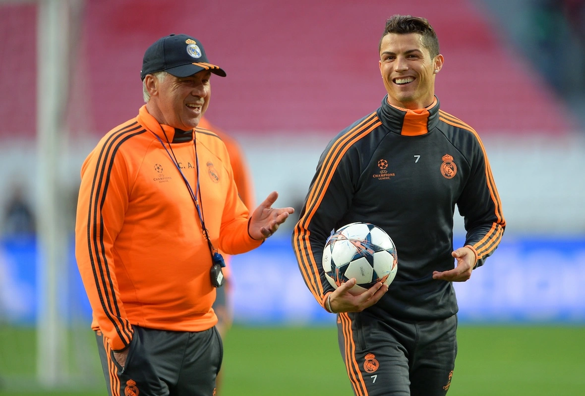 LISBON, PORTUGAL - MAY 23: Head Coach, Carlo Ancelotti of Real Madrid shares a joke with Cristiano Ronaldo of Real Madrid during a Real Madrid training session ahead of the UEFA Champions League Final against Club Atletico de Madrid at Estadio da Luz on May 23, 2014 in Lisbon, Portugal. (Photo by Michael Regan/Getty Images)
