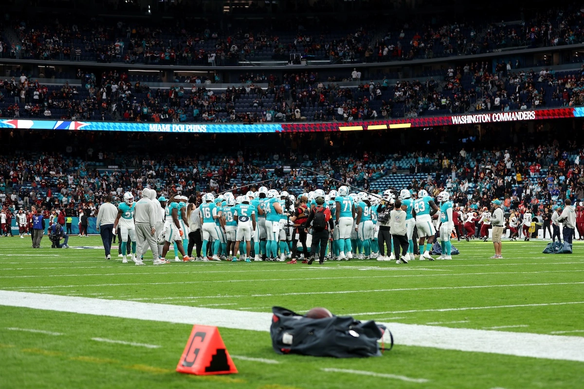 MADRID, SPAIN - NOVEMBER 16: The Miami Dolphins team huddle up prior to the NFL 2025 game between Washington Commanders and Miami Dolphins at Estadio Santiago Bernabeu on November 16, 2025 in Madrid, Spain. (Photo by Florencia Tan Jun/Getty Images) l Real Madrid